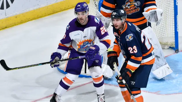 Greenville Swamp Rabbits forward Michael Pelech (right) vs. the Orlando Solar Bears