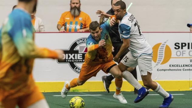 St. Louis Ambush defender Jonatan Santos (right) against the Florida Tropics