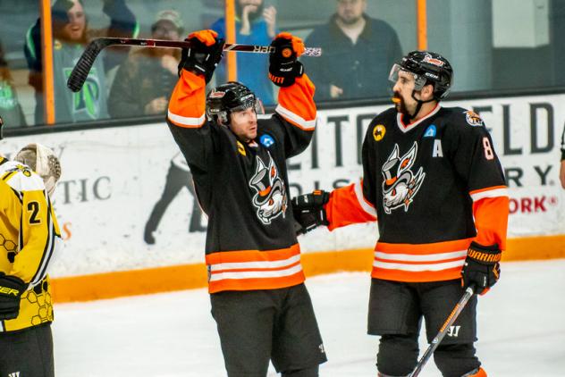 Danbury Hat celebrate a goal against the Battle Creek Rumble Bees