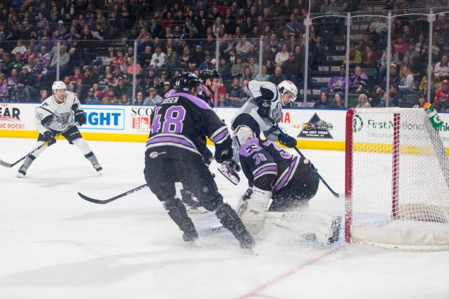 Joey LaLeggia of the San Antonio Rampage (back) scores game-winning goal against the Colorado Eagles