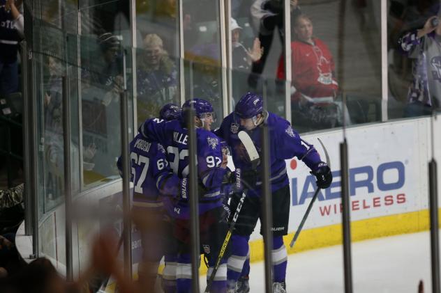 Tri-City Storm huddle up after a goal