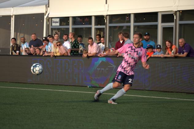 Forward Madison FC fullback Carl Schneider