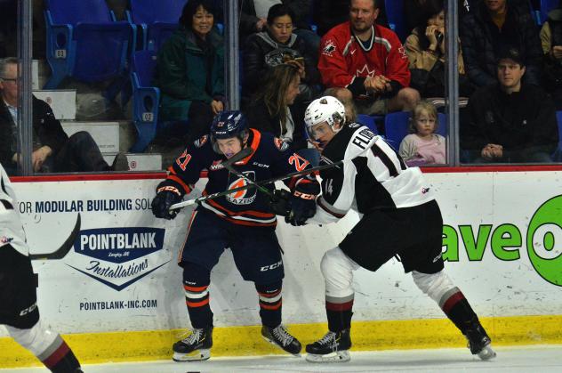 Vancouver Giants centre Eric Florchuk (right) battles the Kamloops Blazers
