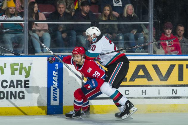 Kelowna Rockets centre Matthew Wedman (right) vs. the Spokane Chiefs