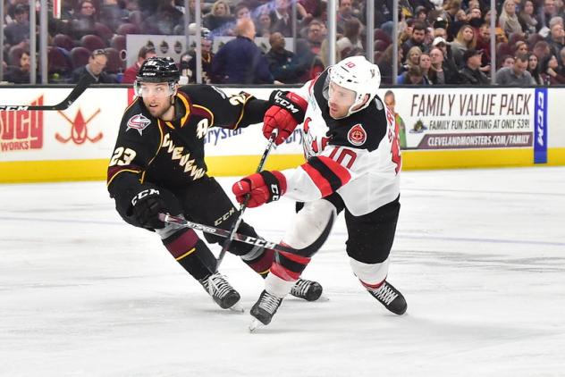 Cleveland Monsters center Stefan Matteau (left) vs. the Binghamton Devils