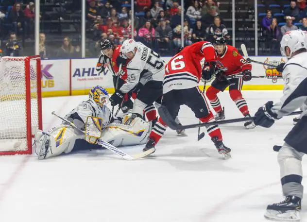 San Antonio Rampage goaltender Ville Husso holds the lead with a late save on Tyler Sikura of the Rockford IceHogs