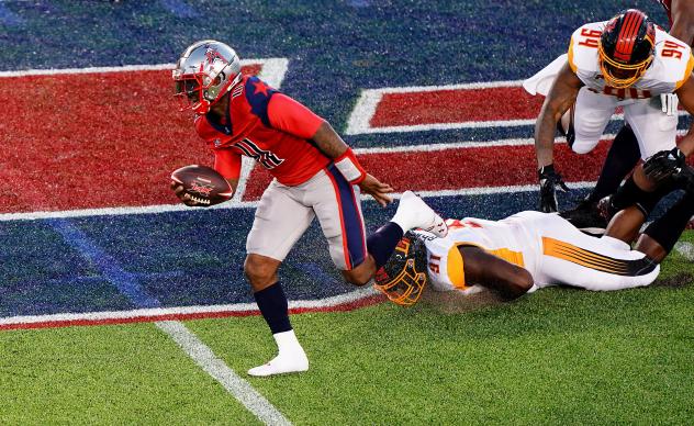 Houston Roughnecks quarterback P.J. Walker breaks past the Los Angeles Wildcats defensive line