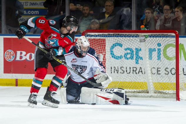 Kelowna Rockets left wing Mark Liwiski (left) against the Tri-City Americans