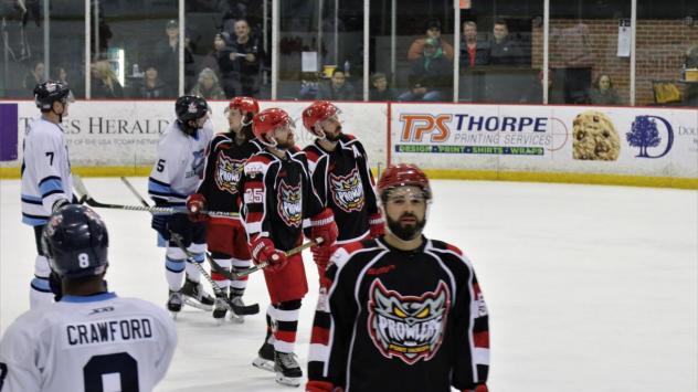 Port Huron Prowlers exchange greetings with the Mentor Ice Breakers