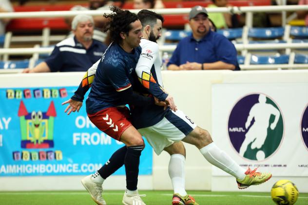 Alex Caceres of the Tacoma Stars fends off a Mesquite Outlaws defender