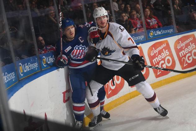 Cleveland Monsters left wing Paul Bittner (right) vs. the Rochester Americans