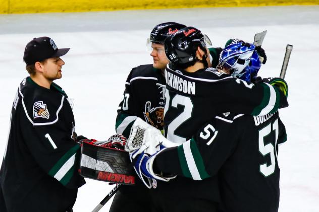 Utah Grizzlies goaltender Martin Ouellette receives congratulations after a shutout