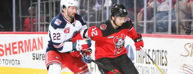 Binghamton Devils right wing Nick Merkley (right) vs. the Hartford Wolf Pack