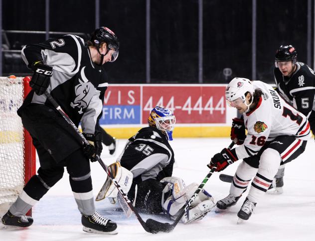 San Antonio Rampage goaltender Ville Husso makes save on Tyler Sikura of the Rockford IceHogs