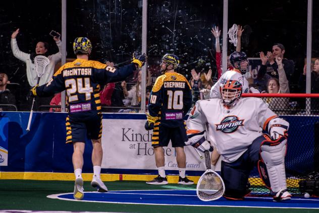Jordan MacIntosh and Alex Crepinsek of the Georgia Swarm following a goal against the New York Riptide