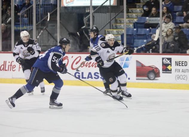 Saint John Sea Dogs defenceman Jeremie Poirier (left) vs. the Charlottetown Islanders