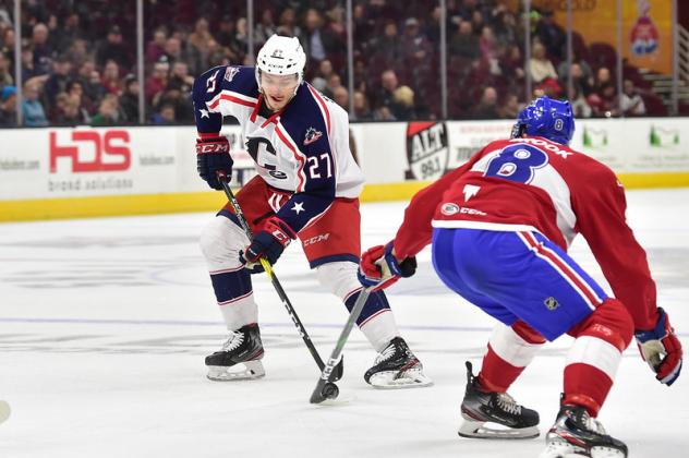 Cleveland Monsters left wing Calvin Thurkauf (left) vs. the Laval Rocket