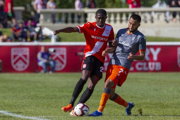 Malyk Hamilton (left) with Cavalry FC