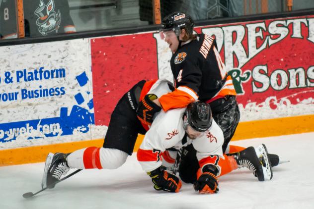 Danbury Hat Tricks defenseman Kruz Listmayer (top) vs. the Danville Dashers