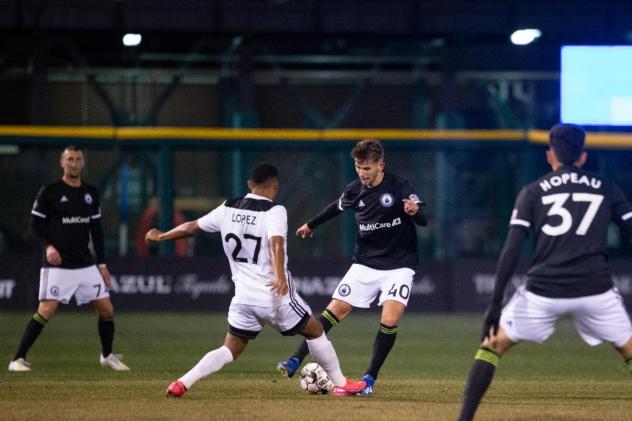 Tacoma Defiance midfielder Christopher Hegardt (right) challenges for possession against Reno 1868 FC