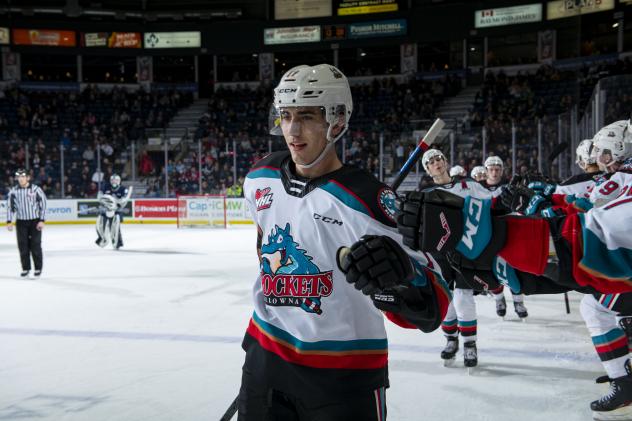 Kelowna Rockets exchange fist bumps after a score