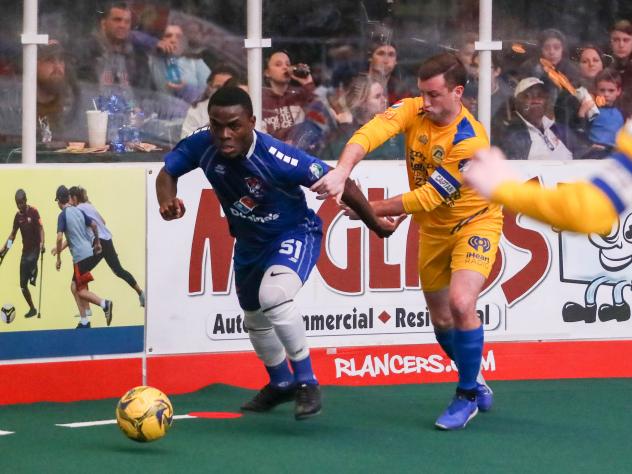 Kansas City Comets defender Robert Palmer (left) vs. the Rochester Lancers