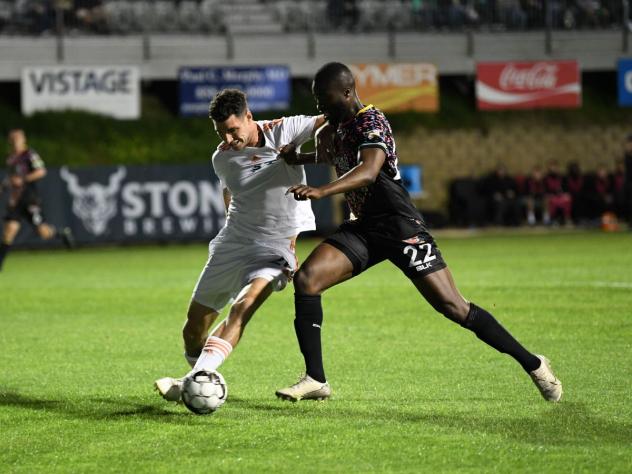 Las Vegas Lights FC striker Seku Conneh (right) vs. San Diego Loyal