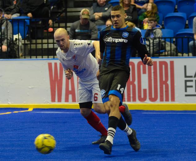 Kansas City Comets forward Adam James (left) vs. Utica City FC