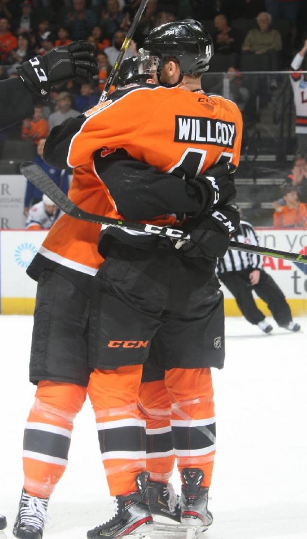 Reece Willcox of the Lehigh Valley Phantoms receives congratulations from his teammates