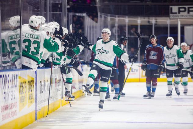 Texas Stars exchange congratulations along the bench vs. the Colorado Eagles