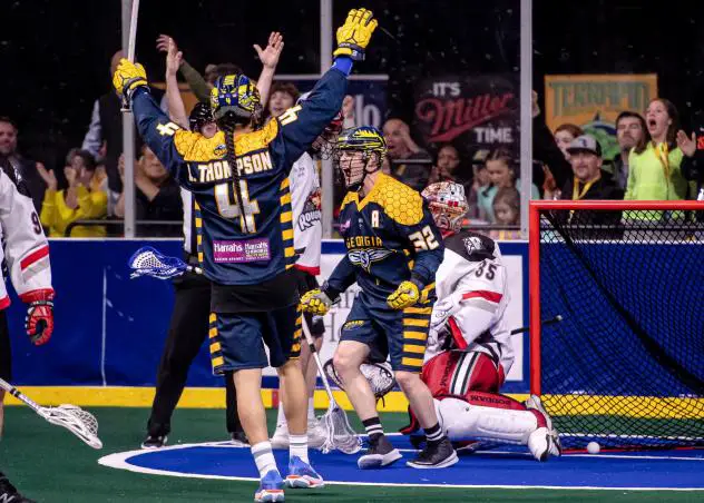 Shayne Jackson (center) and Lyle Thompson celebrate a Georgia Swarm goal