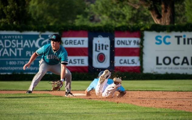 Tyler Finke of the St. Cloud Rox slides safely into second against the Rochester Honkers