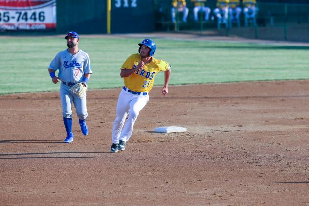 Damek Tomscha of the Sioux Falls Canaries rounds second against the St. Paul Saints