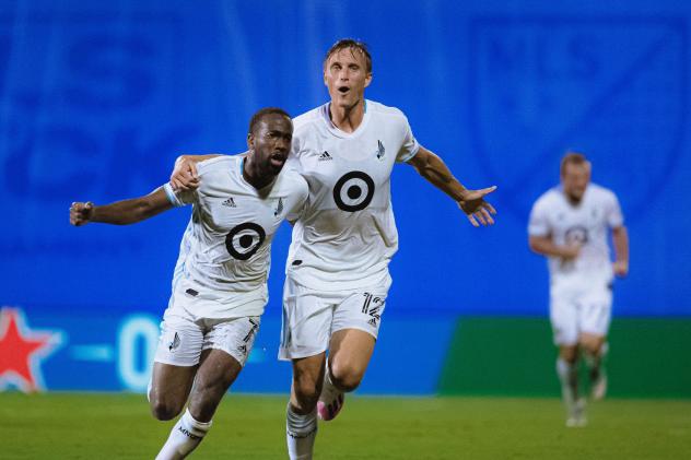 Minnesota United FC celebrates a late goal against Sporting Kansas City