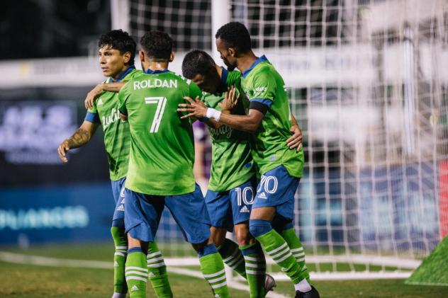 Seattle Sounders FC teammates celebrate with Nico Lodeiro
