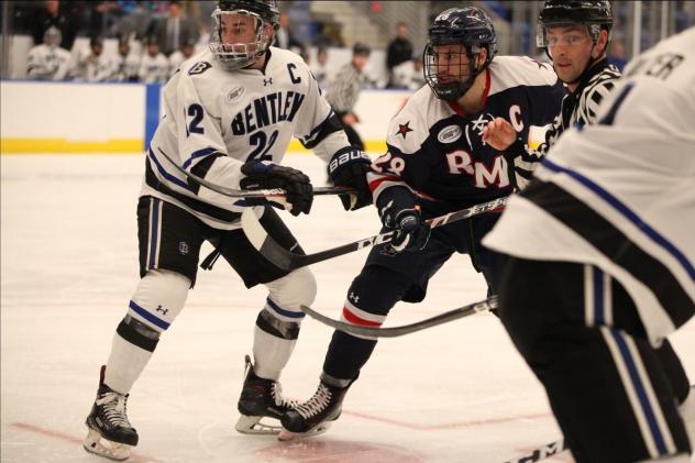 Forward Luke Lynch with Robert Morris University (right)