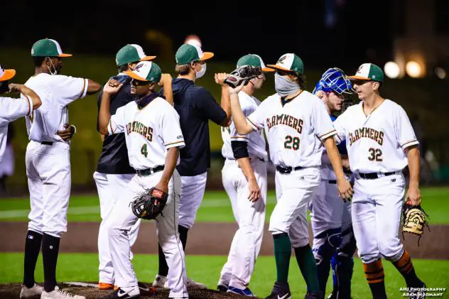 Joliet Slammers and NERDS Herd exchange elbow bumps