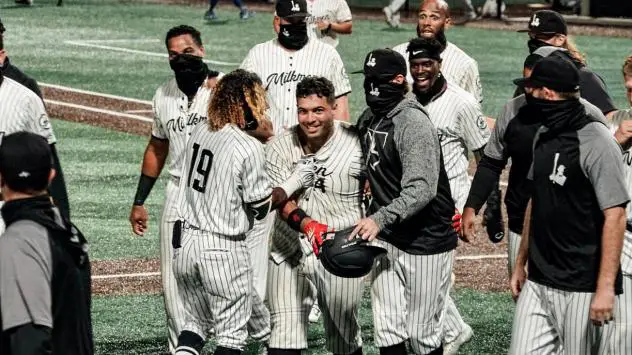 Milwaukee Milkmen mob Christian Correa following his walk off homer