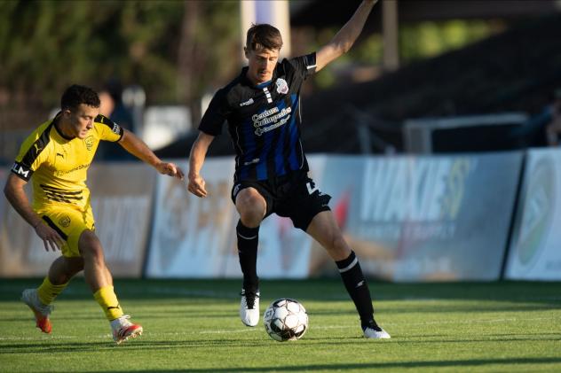 Colorado Springs Switchbacks FC right back Jordan Burt with possession against New Mexico United