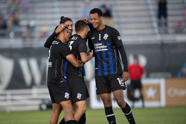 Colorado Springs Switchbacks FC celebrate an Aidan Daniels goal against New Mexico United