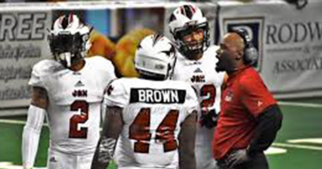 Jacksonville Sharks Head Coach James Fuller talks to the team