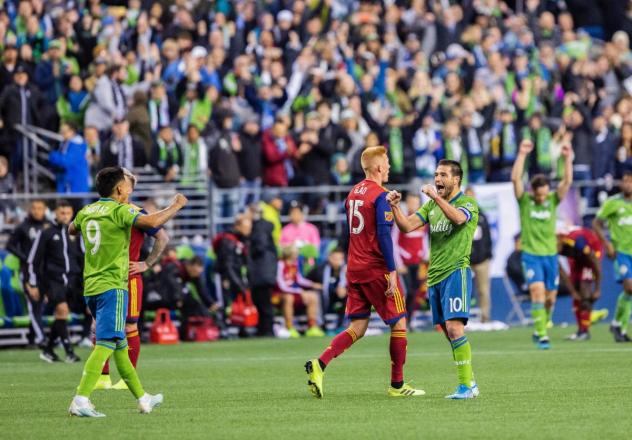Nicolas Lodeiro and Raul Ruidiaz of Seattle Sounders FC celebrate last year's postseason win over Real Salt Lake at CenturyLink Field