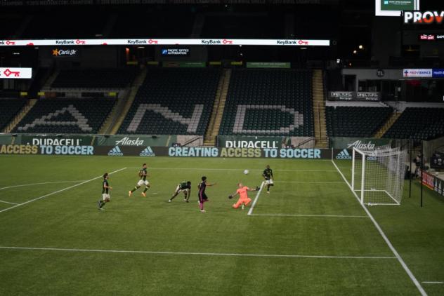 Raul Ruidiaz scores one of his two goals in Seattle Sounders FC's win over Portland on August 23 at Providence Park