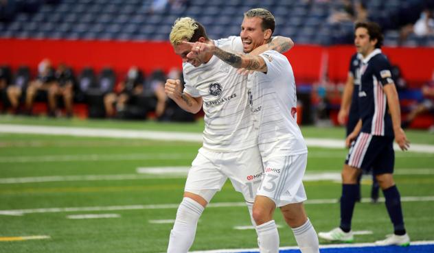 Louisville City FC celebrates a goal against Indy Eleven