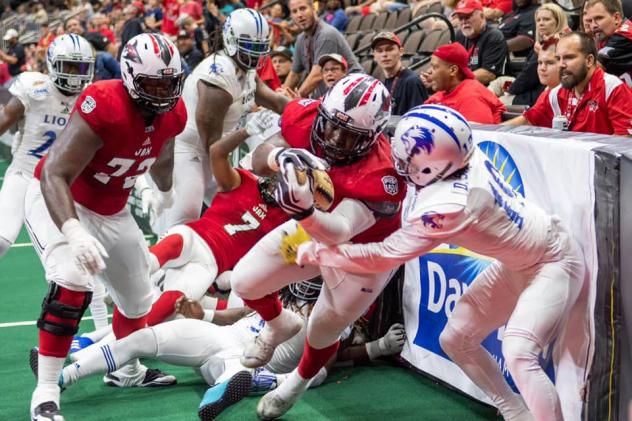 Jacksonville Sharks linebacker/fullback Zack Brown carries the ball against the Columbus Lions