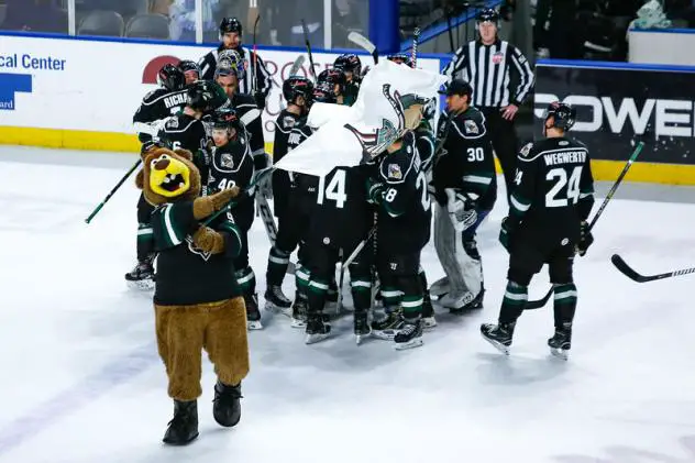 Utah Grizzlies react after a win