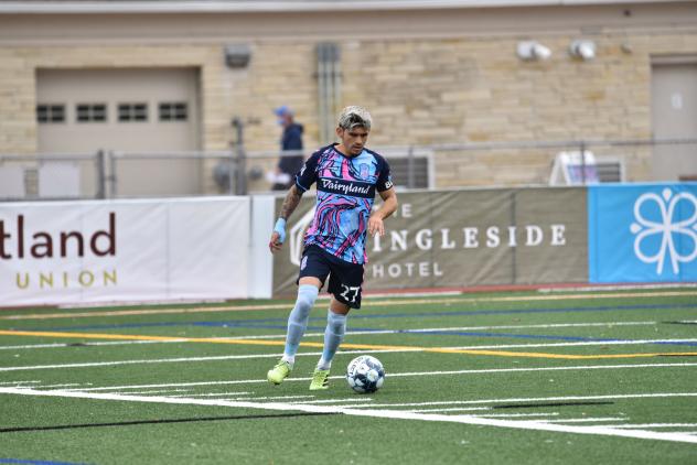 Forward Madison FC defender Christian 