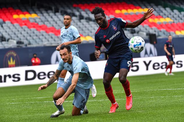 Chicago Fire FC forward CJ Sapong (right) vs. Sporting Kansas City