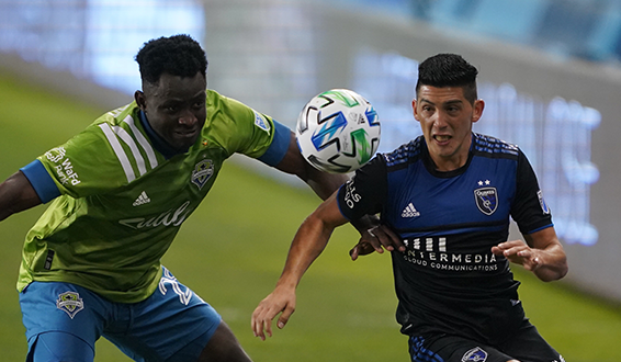 San Jose Earthquakes midfielder Cristian Espinoza (right) vs. Seattle Sounders FC