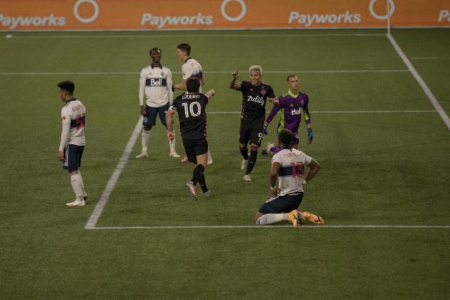 Seattle Sounders FC celebrate a goal against the Vancouver Whitecaps